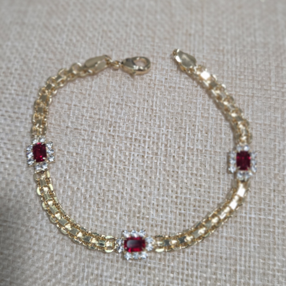 Elegant Gold Bracelet with Ruby Accents